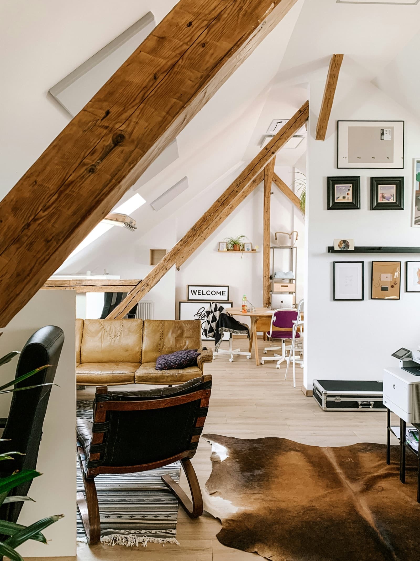 A loft conversion with exposed beams and rooflights