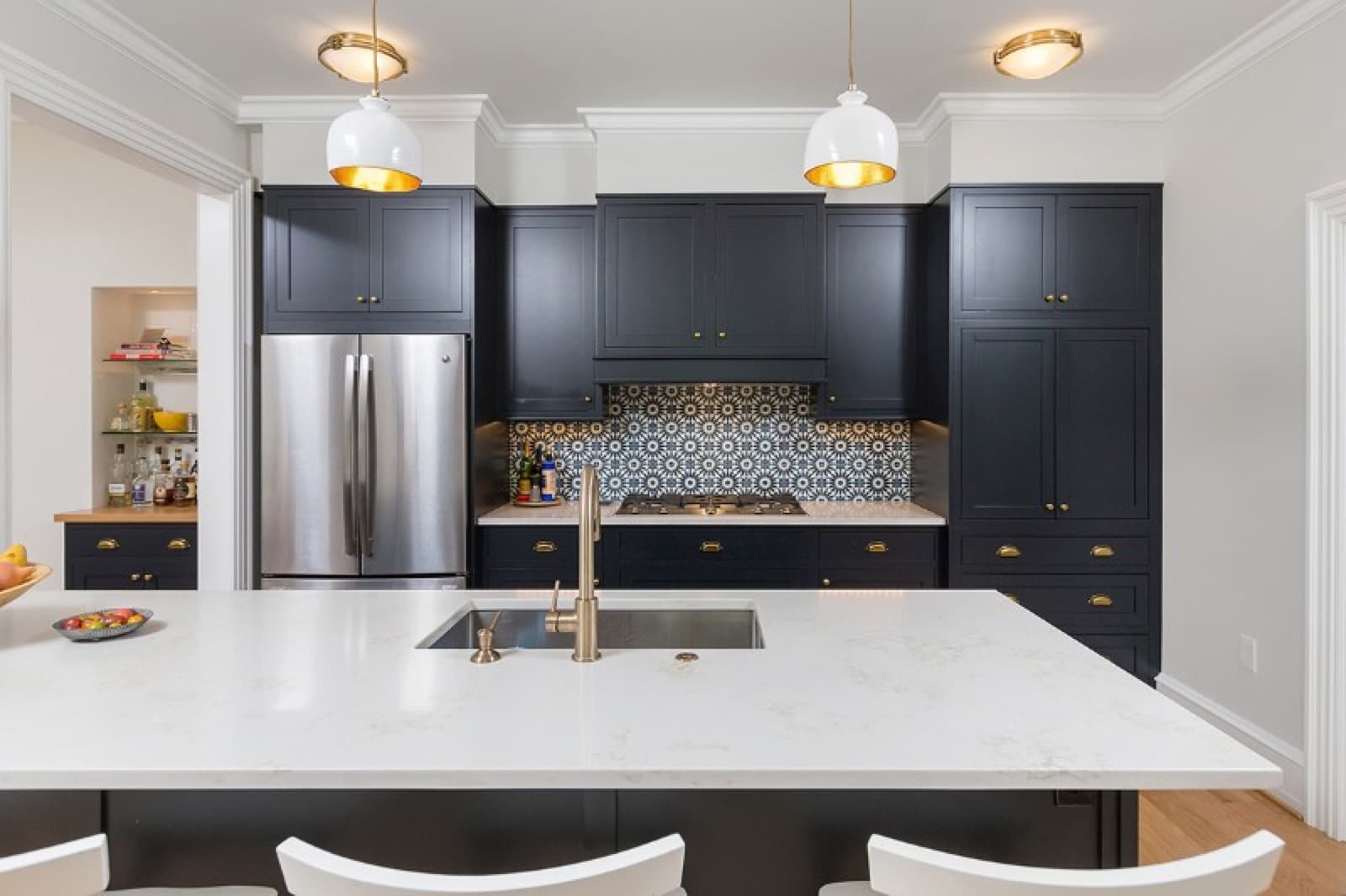 Kitchen installation in Lancaster with dark cabinetry and a stone island